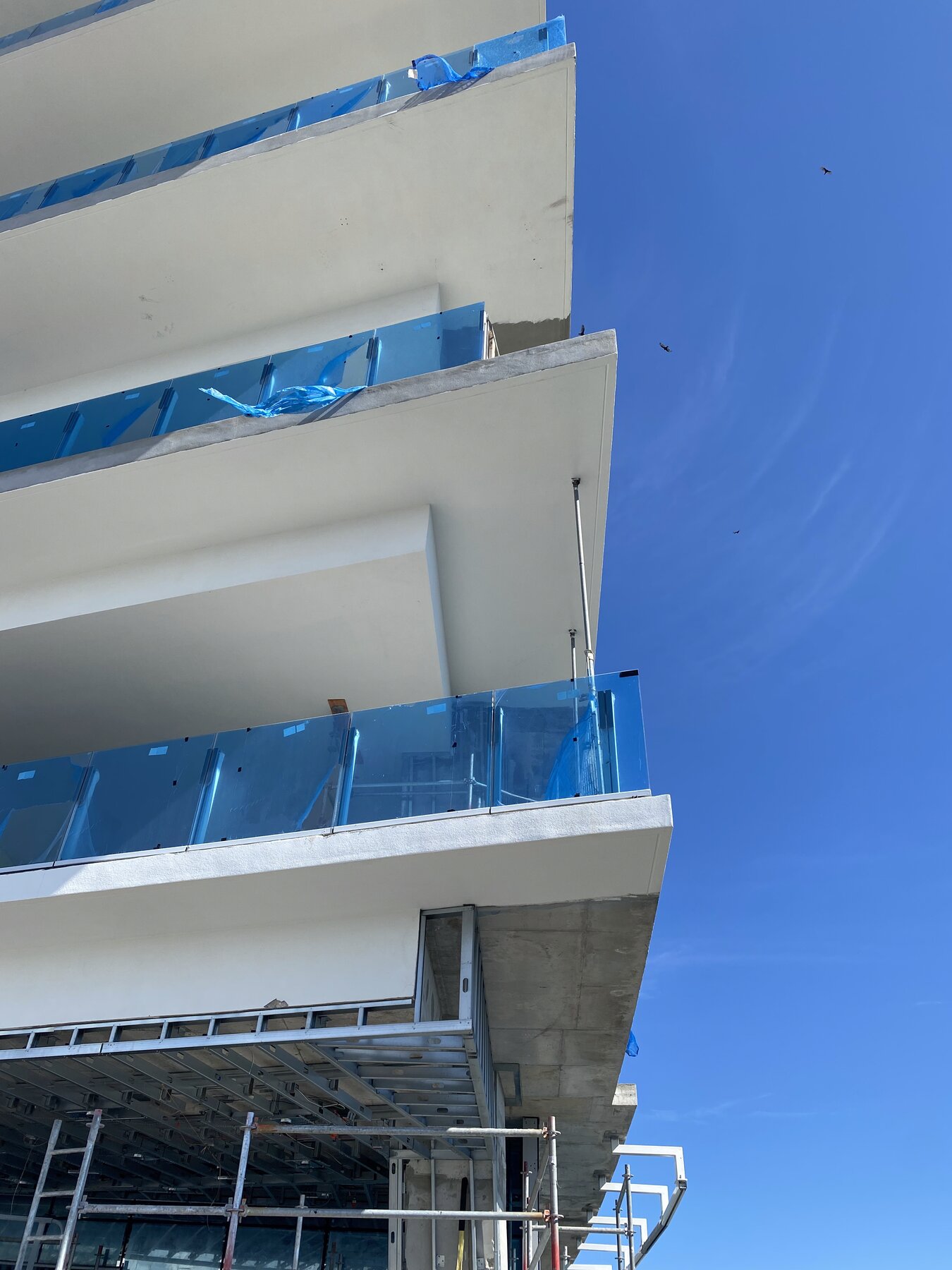 High-rise balconies with glass railings, South Florida