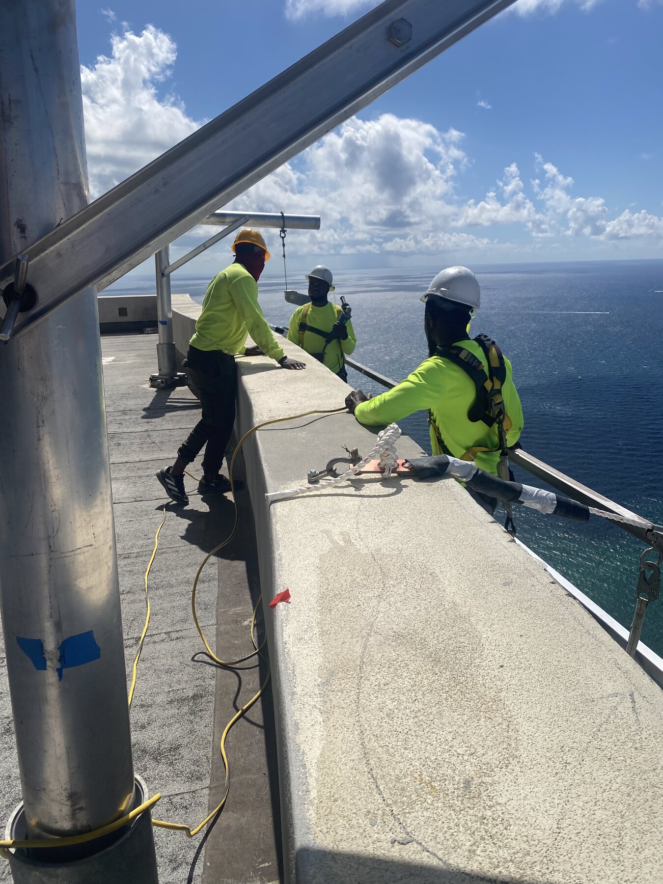 Black Bridge crew on high-rise rooftop, ocean view, South Florida